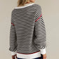 Black & White Striped Sweater with Red Accents