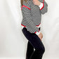 Black & White Striped Sweater with Red Accents