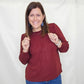 Burgundy Ruffle Smocked Long Sleeve Top. Staccato
