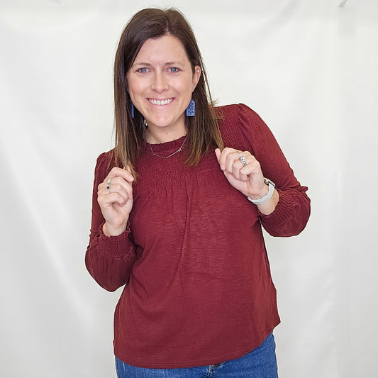 Burgundy Ruffle Smocked Long Sleeve Top. Staccato