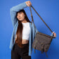 Jen & Co Layla Faux Suede Whipstitch Crossbody w/ Tassel - M2347. Lifestyle view.