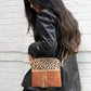 Jen & Co Tara Double Zip Crossbody Bag/Wristlet - M1785. Leopard mustard. Lifestyle photo.
