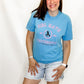Person wearing a blue t-shirt with 'Girl Math University' text and graphic on a white background